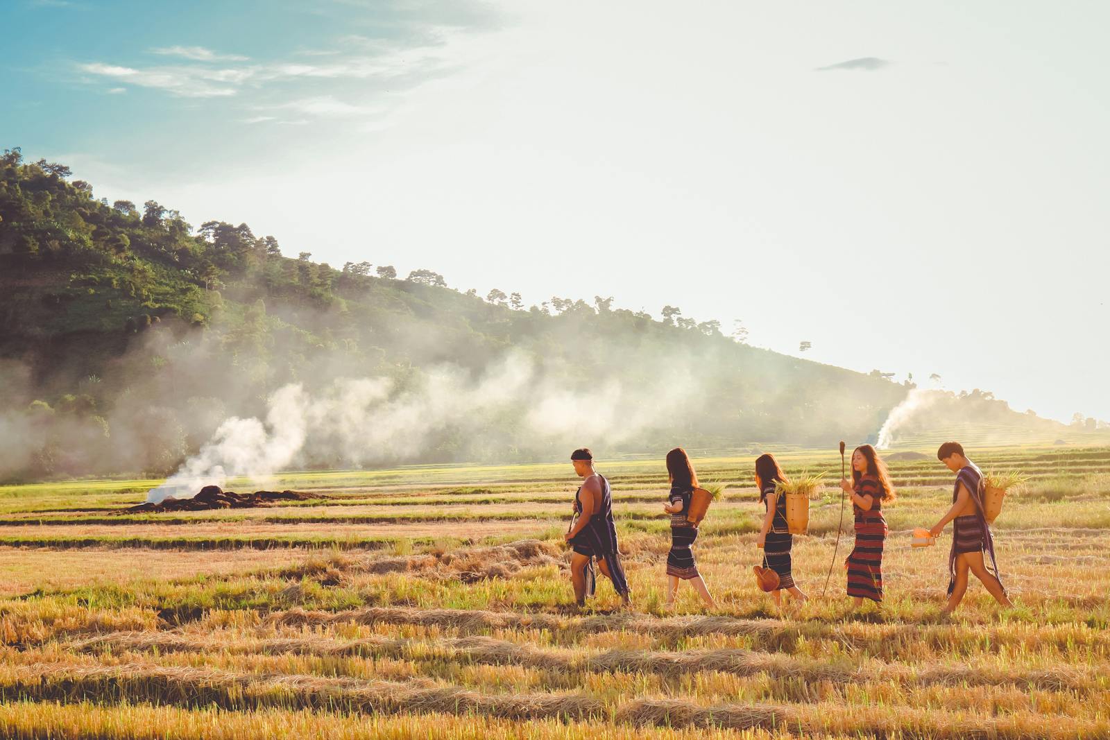 Five People Walking on Paddy